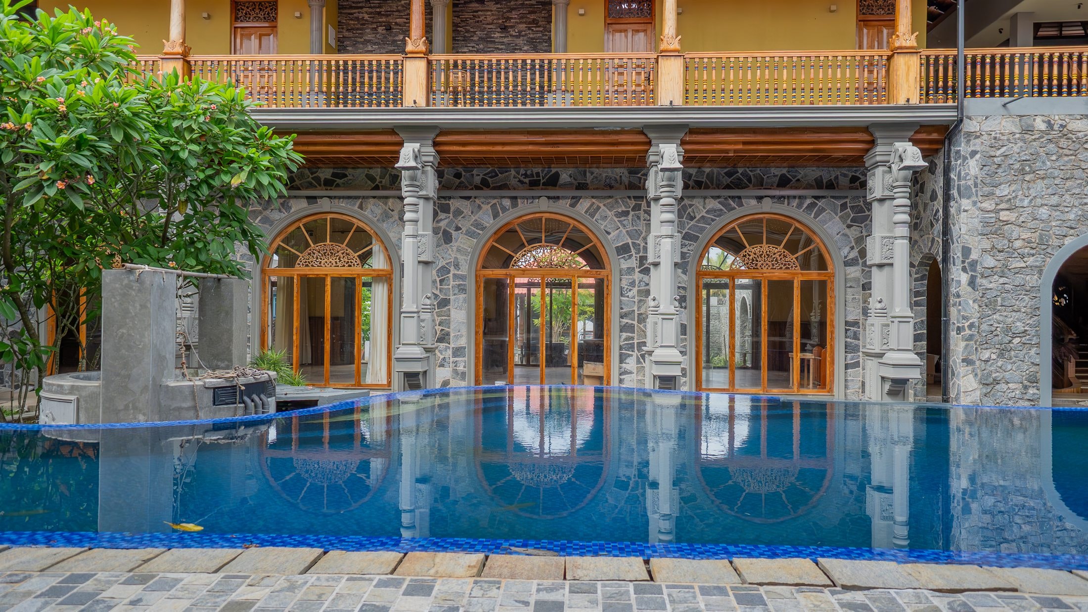 The heritage facade and pool at Minds Boutique Hotel